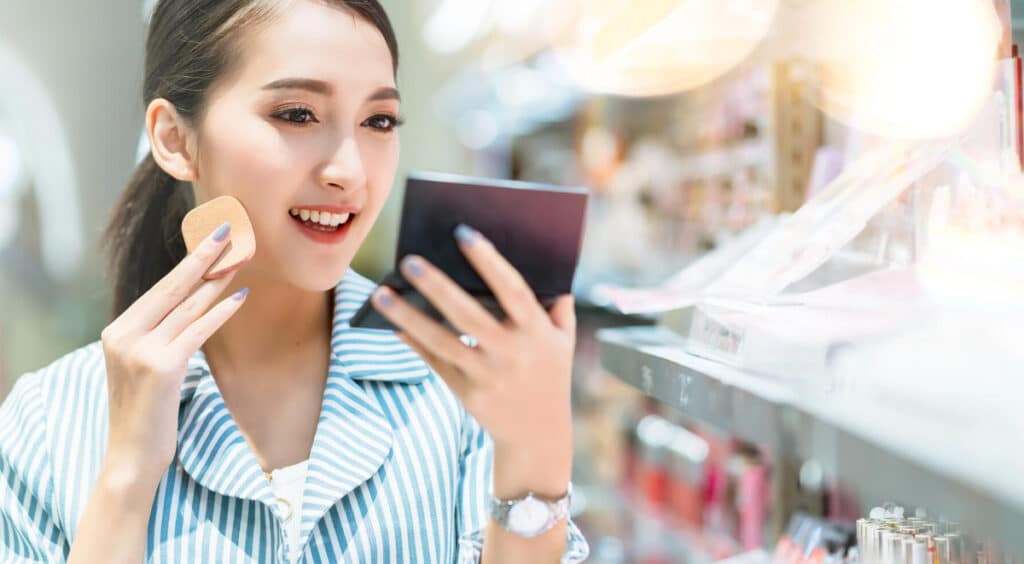 A Korean woman shopping for cosmetics
